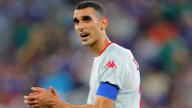 Ellyes Skhiri, capitaine de la Tunisie, tête basse après une défaite lors de la Coupe du Monde 2026 à Monterrey — latest news and analysis.