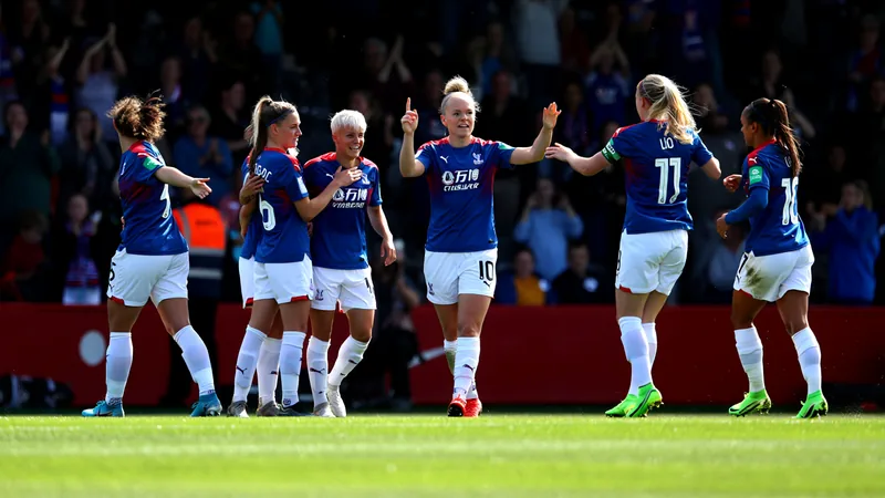 Jogadora de futebol feminino comemorando gol com a camisa do Crystal Palace, em campo gramado, com torcida ao fundo. — latest news and analysis.